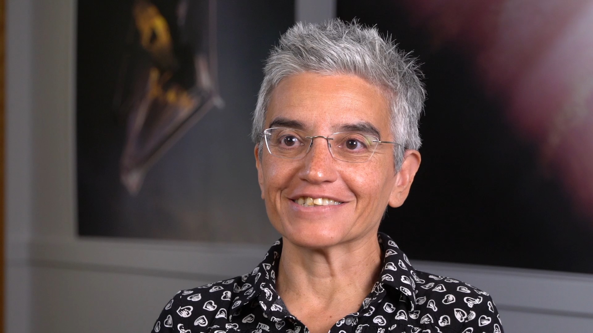 A woman speaks to the camera