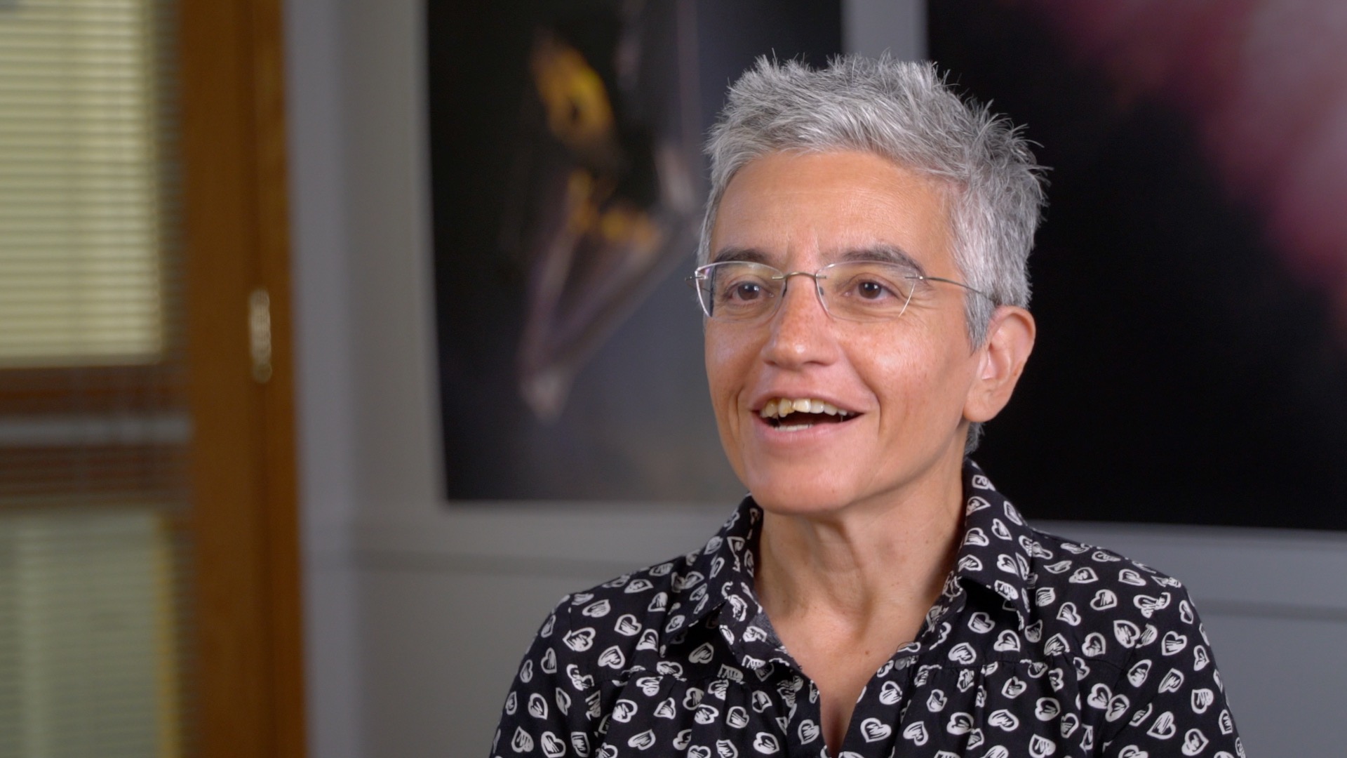 A woman speaks to the camera